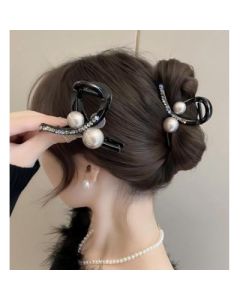 Pearl grip hairpin on the back of the woman's head