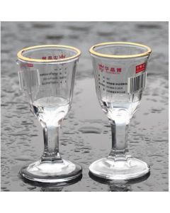 Tall shot glass, painted gold, thickened glass